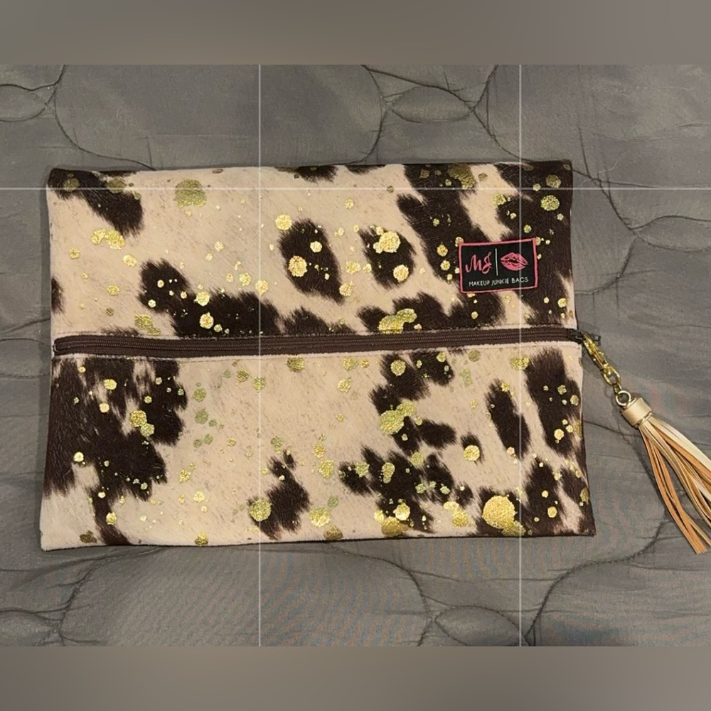 Cow print makeup junkie pouch